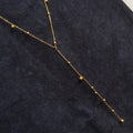 Y-shaped Necklace With A Tassel Pendant And Round Beads