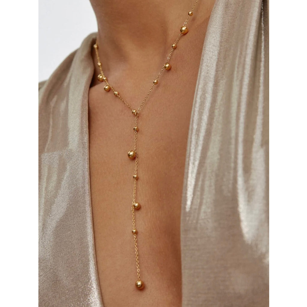 Y-shaped Necklace With A Tassel Pendant And Round Beads